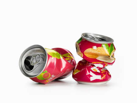 Two squeezed soda cans isolated on a white background. Recycling and recycling concept.