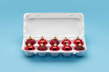 Christmas balls, Christmas tree decorations, in white egg packaging. Winter holidays, merry...