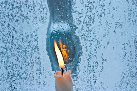 Christmas background â frost pattern and candleの写真素材