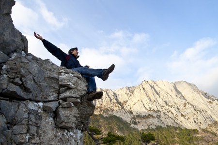 man on top of the mountain