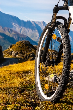 Mountain bike wheel and sommer alpine  landscapeの写真素材