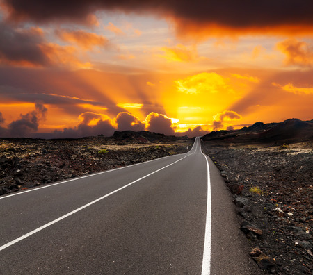 yellow sunset over asphalt road Canary island Lanzaroteの写真素材