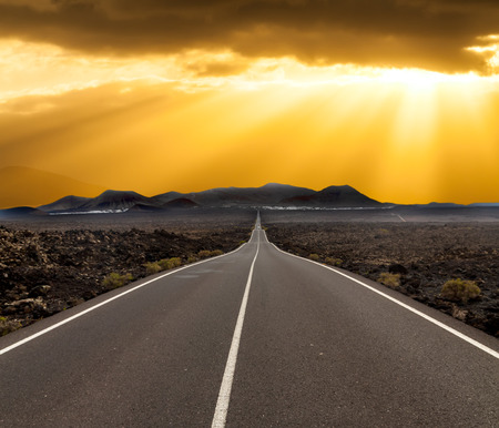 yellow sunset over asphalt road Canary island Lanzaroteの写真素材