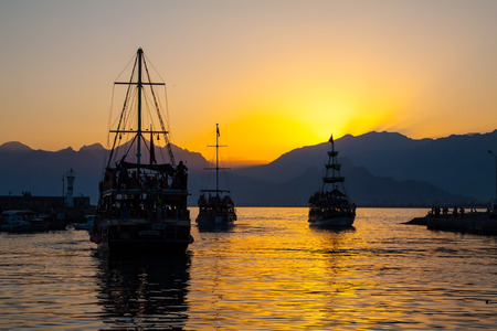 Ships silhouette in Antalya  bay at sunset の写真素材