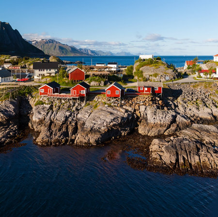 Scenic town of Reine by the fjord on Lofoten islands in Norway on sunny summer dayの写真素材