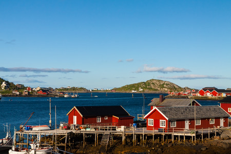 Scenic town of Reine by the fjord on Lofoten islands in Norway on sunny summer day
