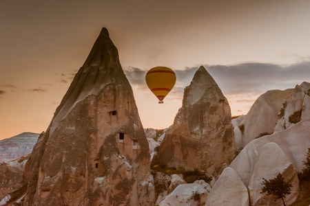 Hot air balloon trip flying over landscape at Cappadociaの写真素材