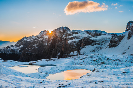 Snow and mountain lake Lago dei Piani near Drei Zinnen or The cime, Italy Alps Dolomitesの写真素材