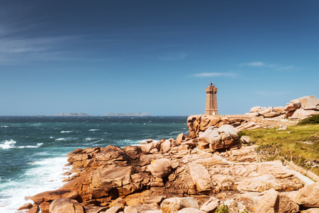 Ploumanach Mean Ruz lighthouse pink granite coast, Perros Guirec, Brittany, Franceの写真素材