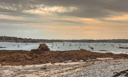 shoreline and fishing boats at low tide, Brittany, Franceの写真素材
