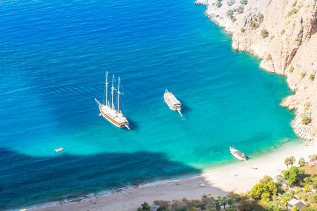 Summer butterfly valley sea beach view and cruise boat Oludeniz,Turkeyの写真素材