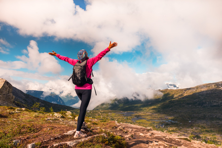 Hiker on the mountain top. Sport and active life concept. Trolltunga Norwayの写真素材