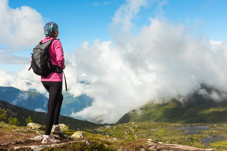 Hiker on the mountain top. Sport and active life concept. Trolltunga Norwayの写真素材