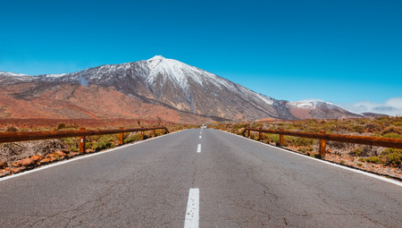 Road in volcanic desert Tenerife, Canary. Asphalt and white line on roadの写真素材
