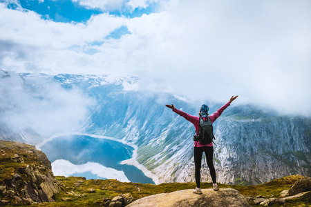 Hiker on the mountain top. Sport and active life concept. Trolltunga Norway