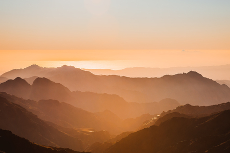 Gold sunset arid desert landscape with mountains silhouette Sinai, Egyptの写真素材