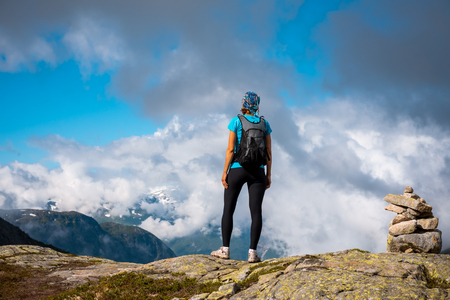 Hiker on the mountain top. Sport and active life concept. Trolltunga Norwayの写真素材