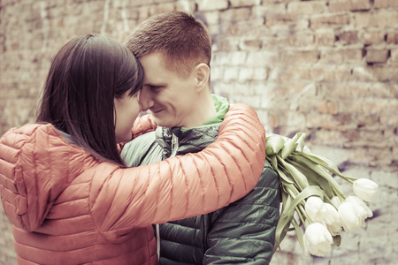 Date of middle aged Loving couple kissing at spring city streetの写真素材