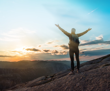 Woman successful hiking silhouette in mountains, motivation and inspiration in beautiful sunset....