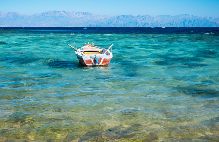View to coastline of Red sea and fishing boat, Egyptの写真素材