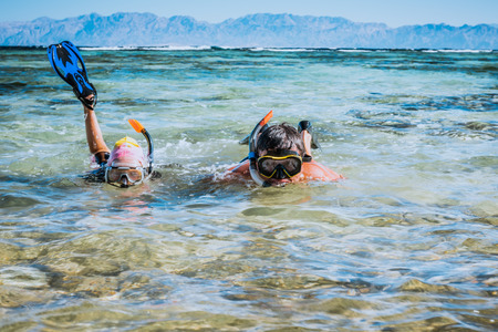 Father and daughter in Red sea with snorkles. Tropical resort, Egyptの写真素材