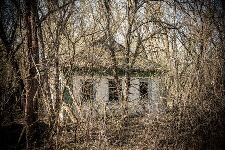 Building of abandoned kindergarten in destroyed village of Kopachi 10-km Chernobyl NPP alienation zone, Ukraineの写真素材