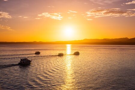 Tourist cruise boats at sunset, Sharm El Sheikh resort, Egypt