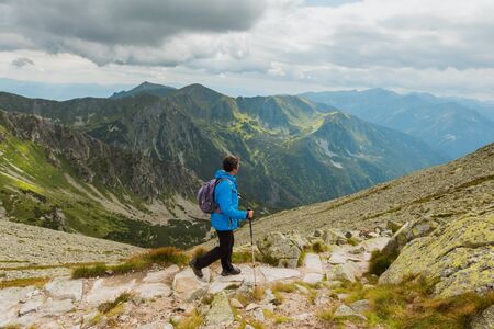 Sporty hiker near summer spring in Tatra Mountains national park, Zakopane, Polandの写真素材