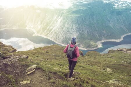 Hiker on the mountain top. Sport and active life concept. Trolltunga Norwayの写真素材