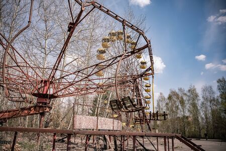 Old ferris wheel in the ghost town of Pripyat. Consequences of the accident at the Chernobyl nuclear power plantの写真素材