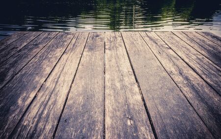 Vintage wooden boards with forest lake background Rest on forest lakeの写真素材