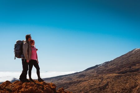 sporty couple on top of mountain. Achievement success healthy lifestyle, Tenerife Canaryの写真素材