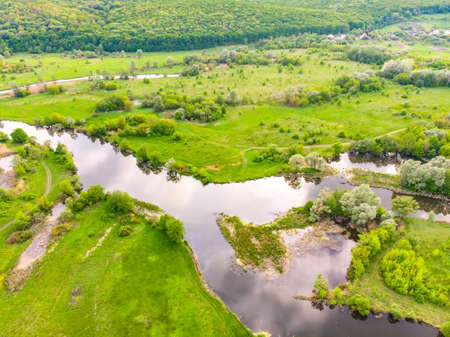 aerial drone landscape of river in green field, top view of beautiful nature texture from drone