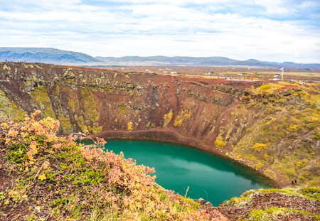 Volcanic crater Kerid with blue lake inside, Iceland tourist attraction