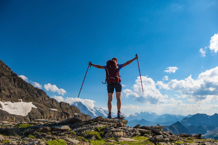 Sporty woman hiking in Switzerland alps. Heathy lifestyle, sport, beauty in nature. Grindelwald...