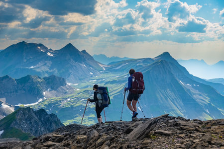 Two sporty woman hiking in Switzerland alps. Heathy lifestyle, sport, beauty in nature. Grindelwald valley, Swizzの写真素材