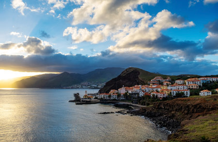 Sunset on Ponta de Sao Lourenco peninsula with traditional resort village. Madeira Island Portugal.の写真素材