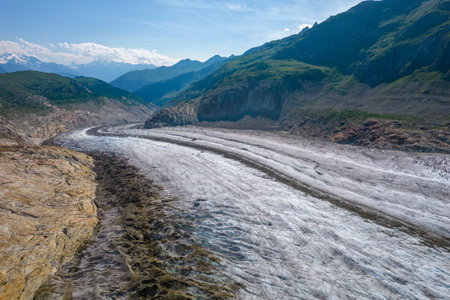 Aerial drone view of Great Aletsch Glacier Alps Switzerland in sunny summer day. Popular tourist destinationの写真素材
