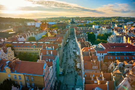 Aerial view of Gdansk at sunset, showcasing the downtown area and St. Marys Basilica. The historical...