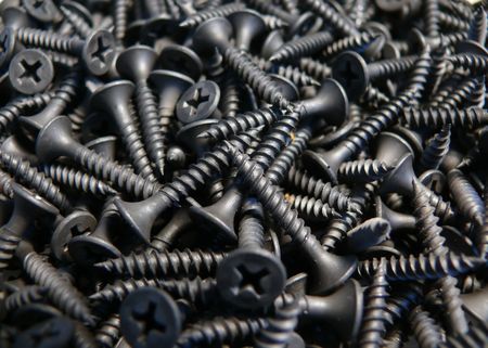 Closeup of metal screws - backgroundの写真素材