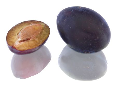 Purple plums isolated on whiteの写真素材