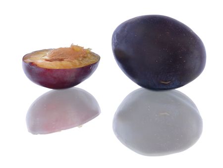 Purple plums isolated on whiteの写真素材
