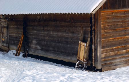 Working barrow on the corner of the barn in the mountain economy. Ukrainian Carpathians.の写真素材
