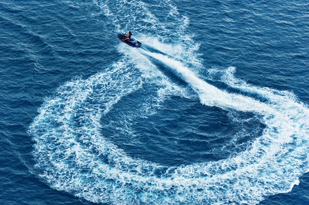 Water motorcycle in the sea and its traceの写真素材