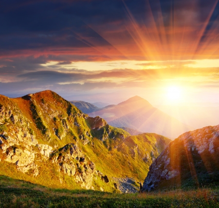 The first beams of a rising sun shine mountains Carpathians, Ukraineの写真素材