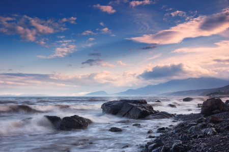 Sea with waves and sky with cloudsの写真素材