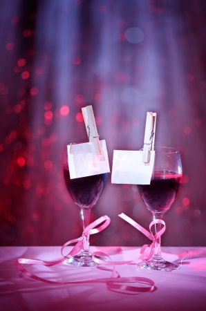 Two glasses of red wine associated with tape  Design on the theme of loveの写真素材