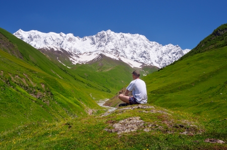Summer landscape with tourist in the mountains of the Caucasus  Shkhara Mountain, Georgia, Caucasusの写真素材