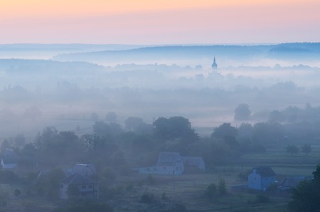 Morning landscape with mist over the river  Dome of the Church in the fog  A village in the Ukraine  Europeの写真素材