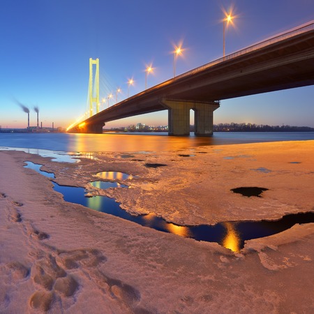 Night cityscape with bridge and illumination  Ice water  Dnipro River, Kyiv, Ukraine の写真素材